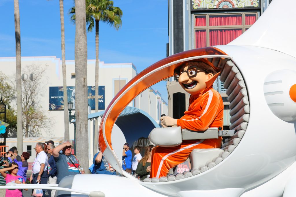 Vector rides by in his spaceship float during the parade. 