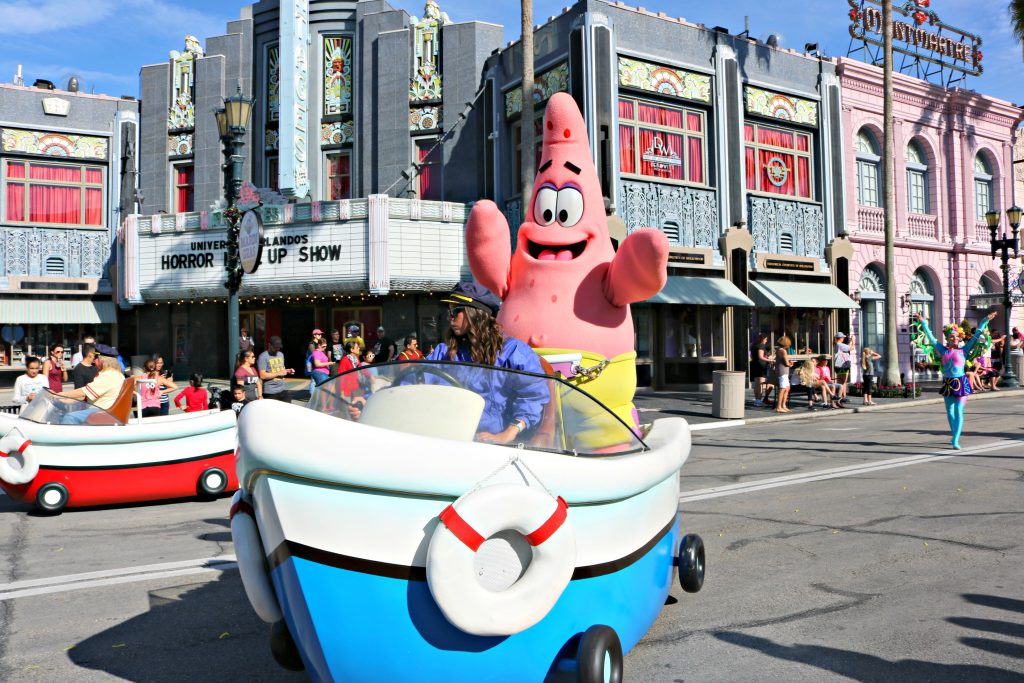 Patrick smiles happily on his boat float.