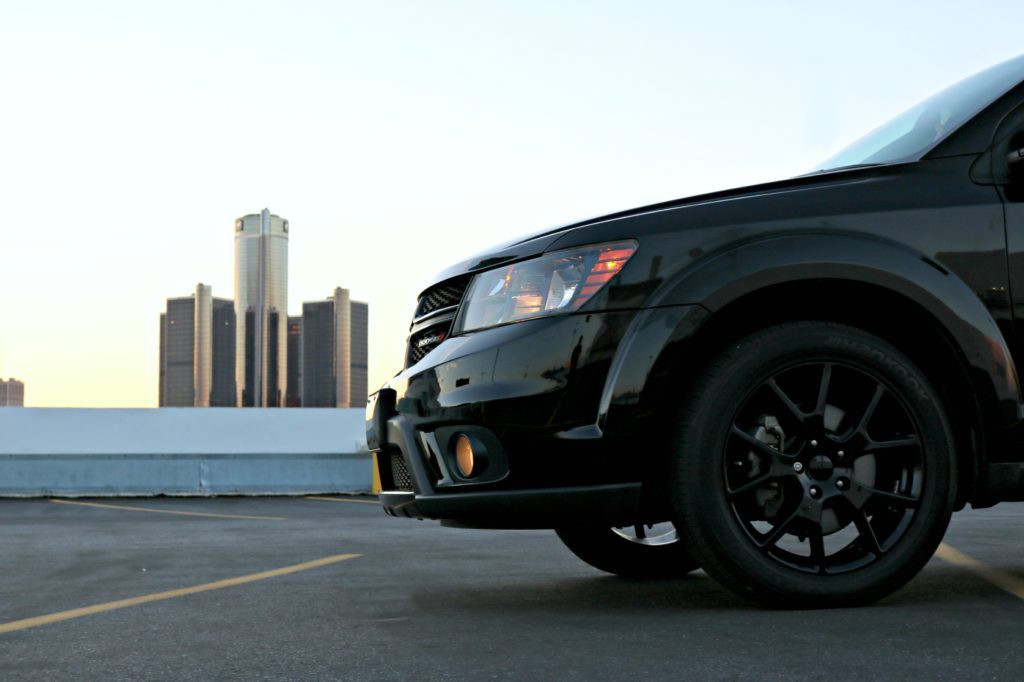 A family is shown inside a Dodge Journey taking a ride.