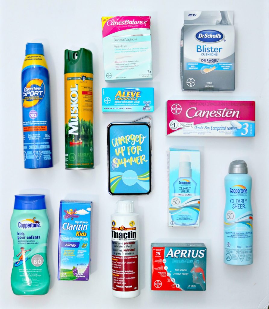 A flat lay of a wide array of Bayer products. From sunscreen to allergy medicine and more.