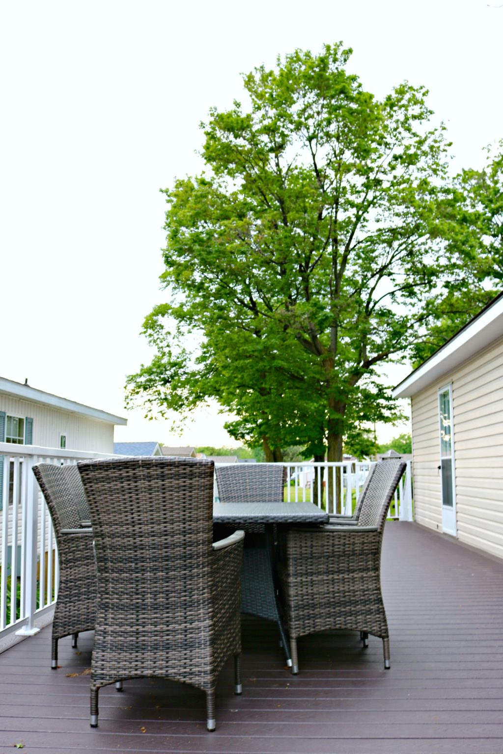 A picture of a dining set sitting on the deck of a Sherkston Shores property.