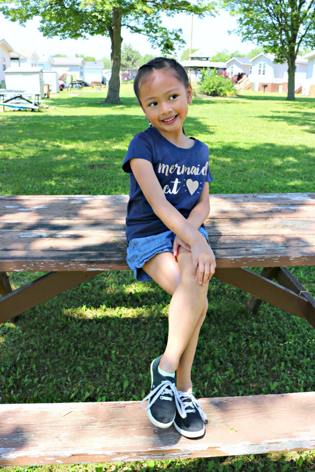 Mimi poses on a picnic table at Sherkston Shores.
