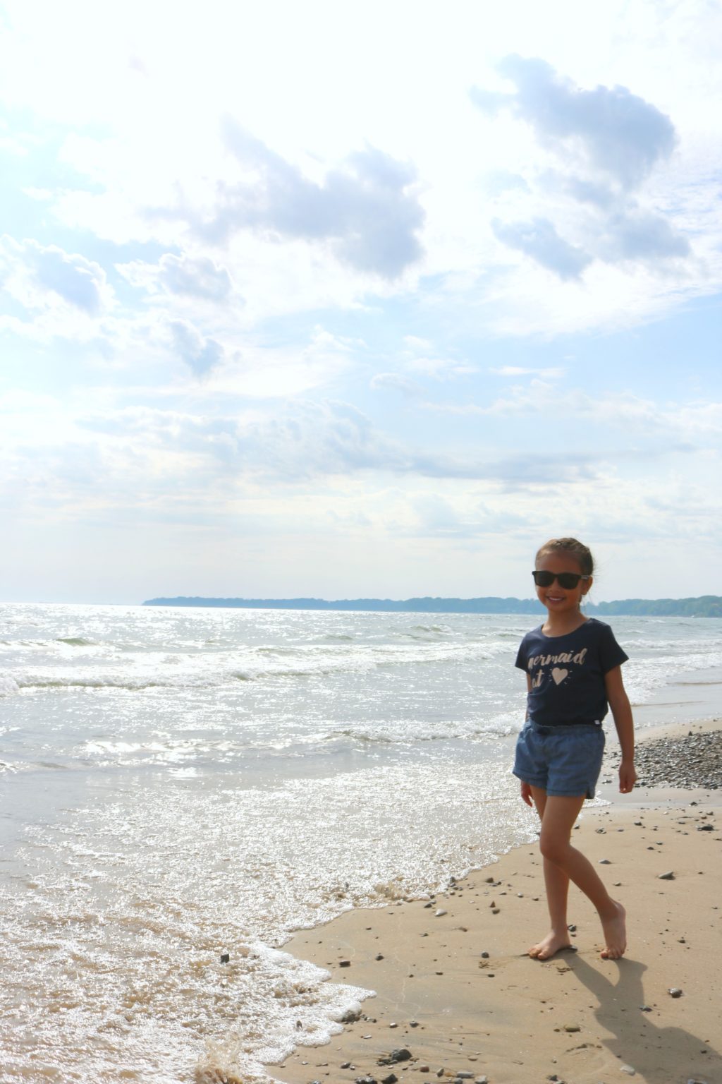 Mimi standing in front of the beach at Sherkston Shores. 