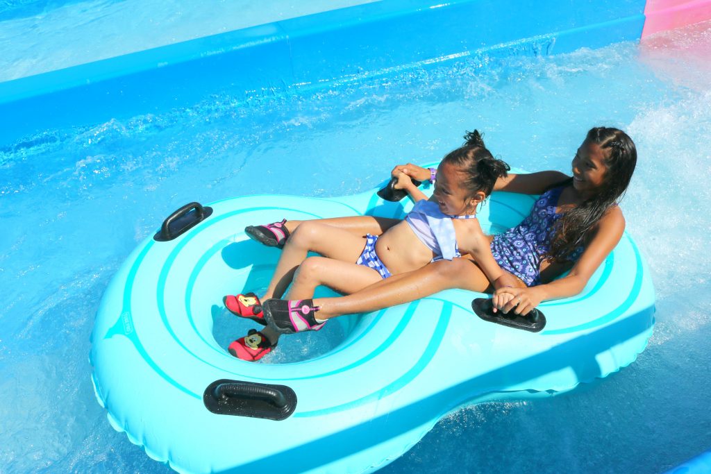 A close-up of Gabby and Mimi on a floatie. 