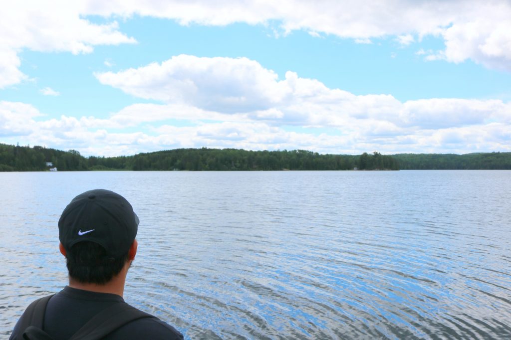 Darasak stares out onto the lake.