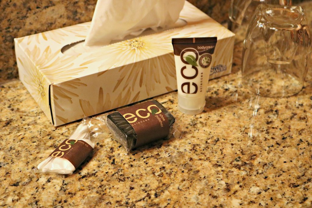 Tissues and an ECO brand of lotion, soap and toiletries are shown. 