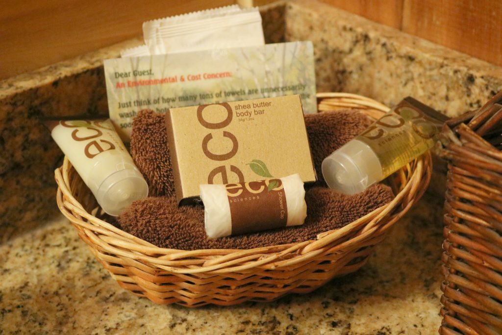 ECO toiletries, face towels, are in a basket. 