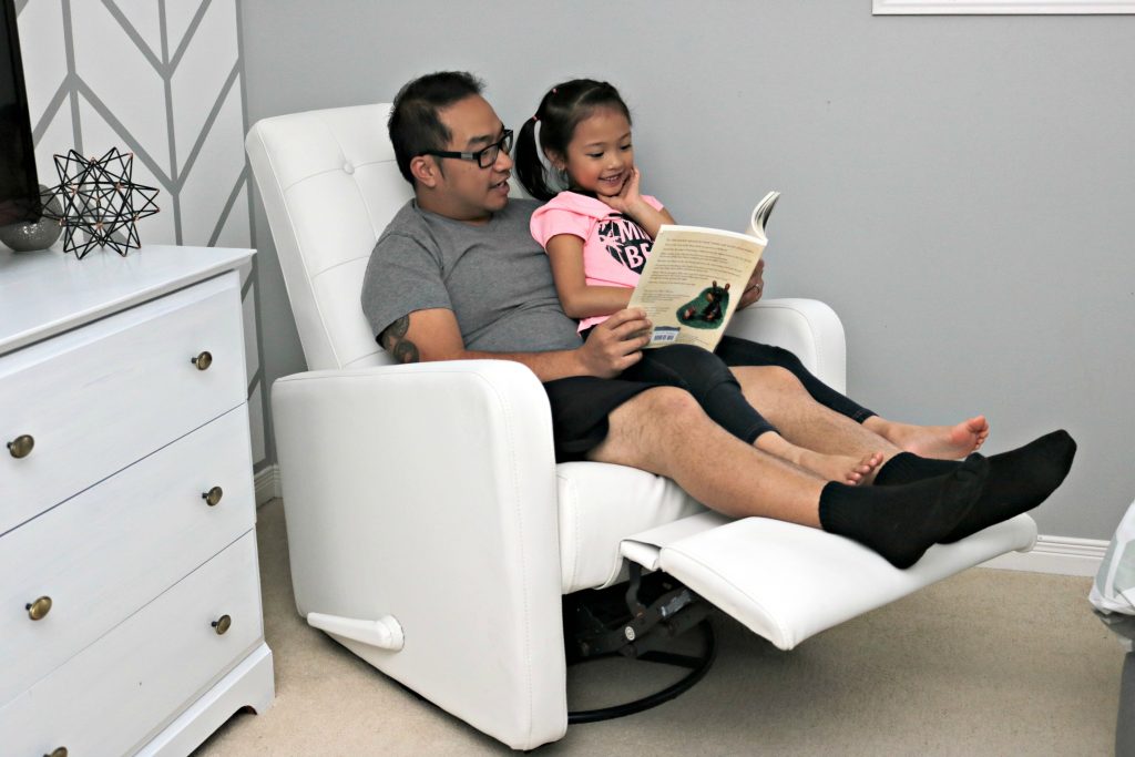 Darasak and Mimi are shown on the recliner with the legs extended. 