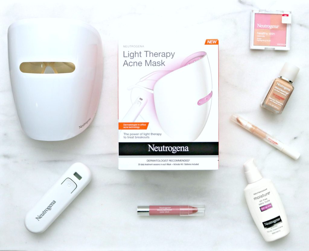 A flat lay of the Neutrogena Light Therapy Acne Mask and Neutrogena make-up and moisturizer.