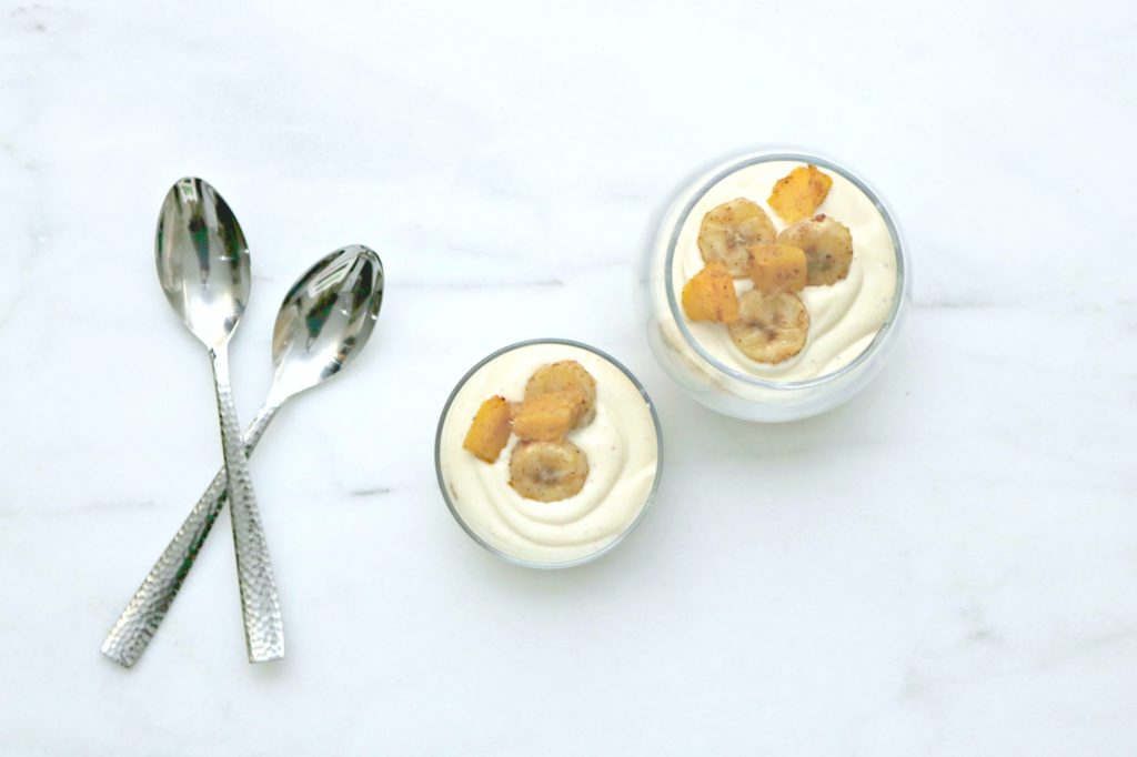 Top view of cheesecake dessert with two spoons.