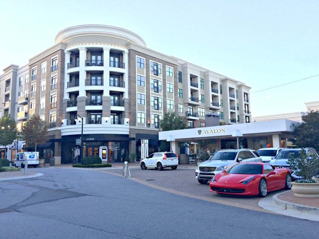 The Avalon shopping centre, a Ferrari and other cars are parked in the valet. 