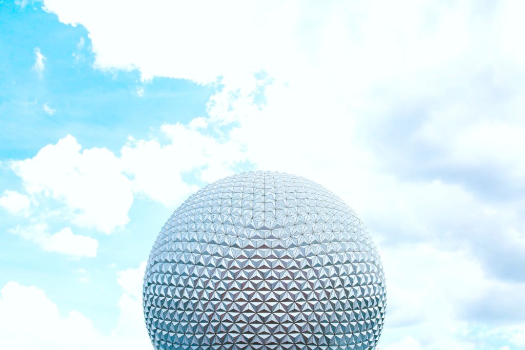 The Spaceship Earth geosphere is pictured against a blue sky. 