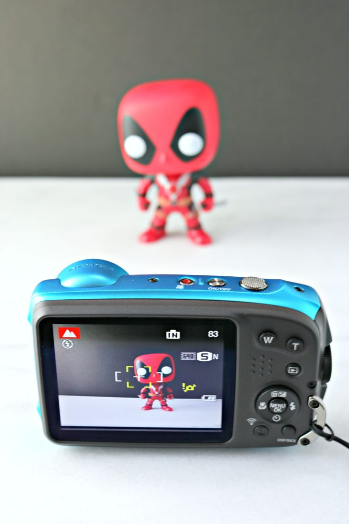 The Fuji XP 120 focuses on a Deadpool figurine. 