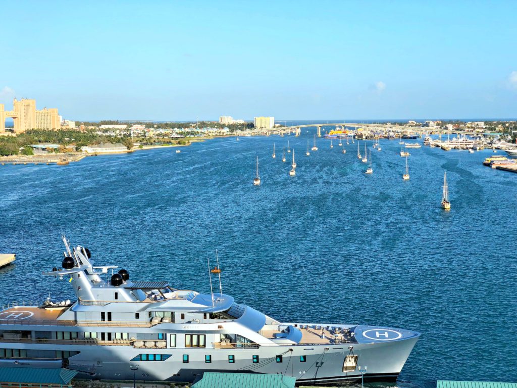 The port of Nassau is lined with sailboats and private yacht. 