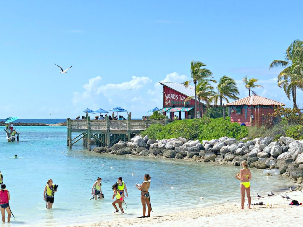 Castaway Cay family beach with snorkelers.