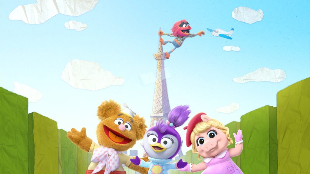 The Muppet Babies gang stand in front of a paper Eiffel Tower.