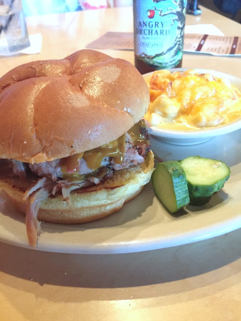 Pulled pork sandwich and mac and cheese with an Angry Orchard. 