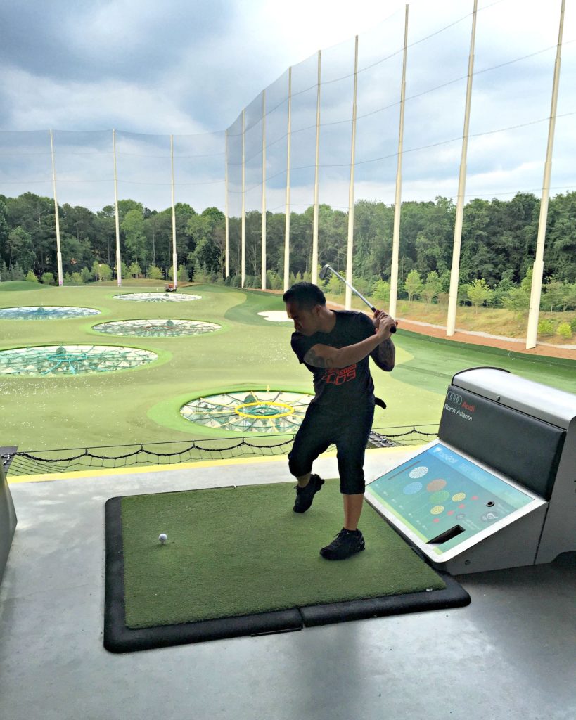 Darasak driving golf balls at Top Golf in Alpharetta, Georgia. 