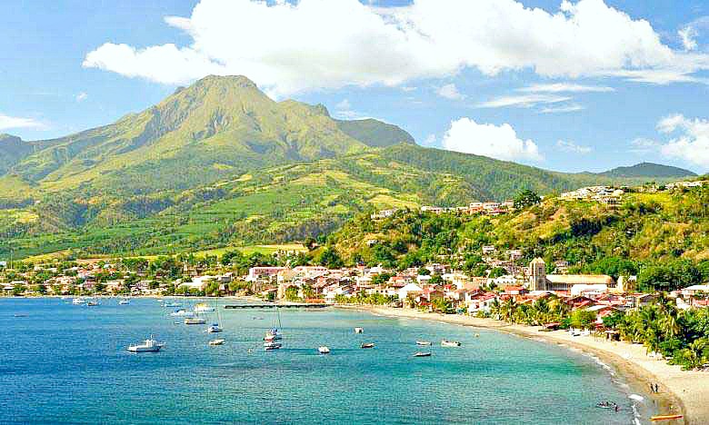 The beautiful island of Martinique has turquoise waters and large, green hills. 