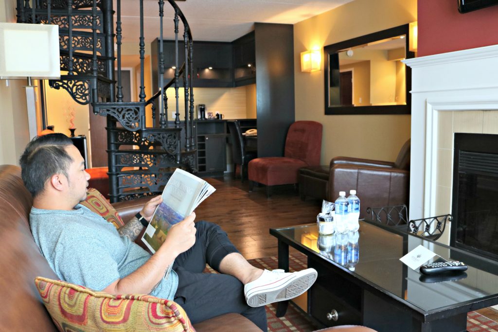 A man sits in the living room of the Executive Suite at Hockley Valley Resort. 