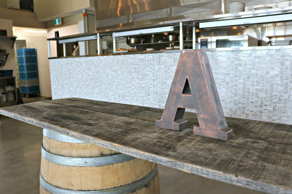 An A is shown on a rustic table in one of the halls available for rent. 