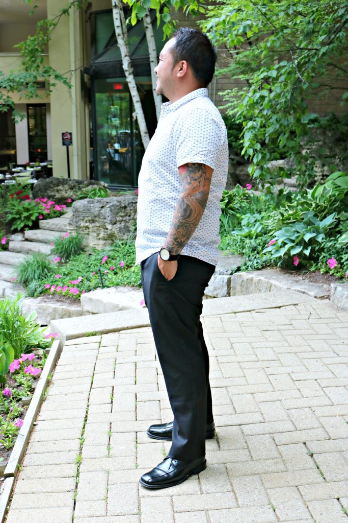 A man smiles while he looks out towards the pool at Hockley Valley Resort.