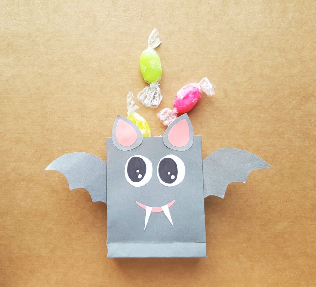 Cute grey bat treat bag with hard candies. 