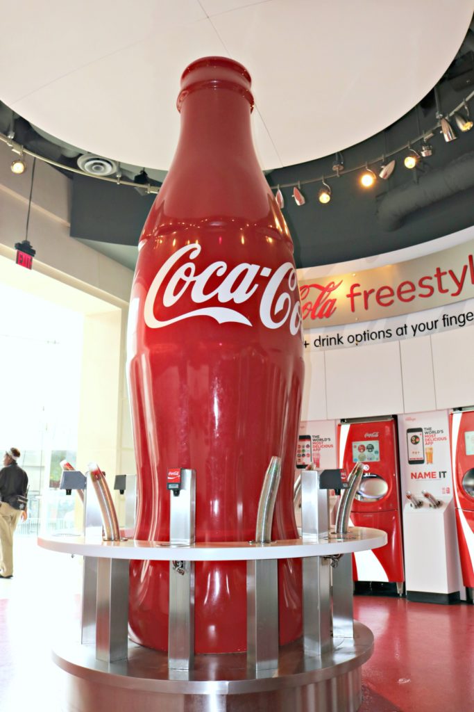 Huge Coca-Cola bottle and pop machines for all you can drink at Coca-Cola. 