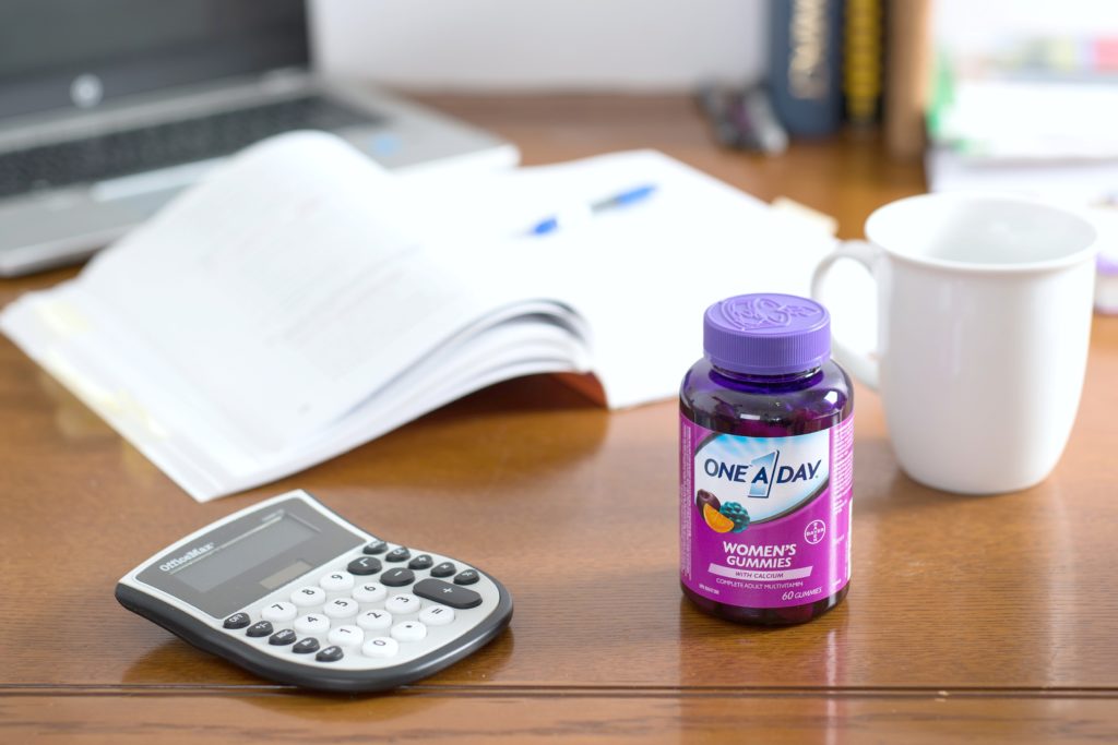 One a Day vitamins on a desk. 