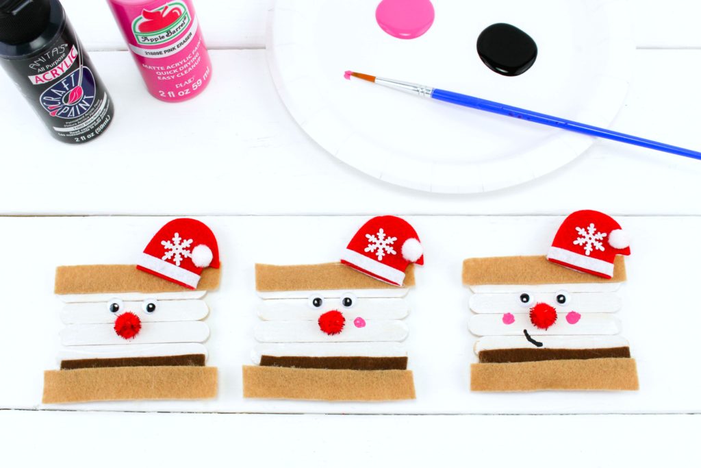 Stick on Santa hat, eyes, and nose and paint on cheeks. 
