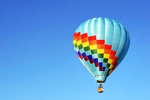 A hot air balloon against a blue sky.