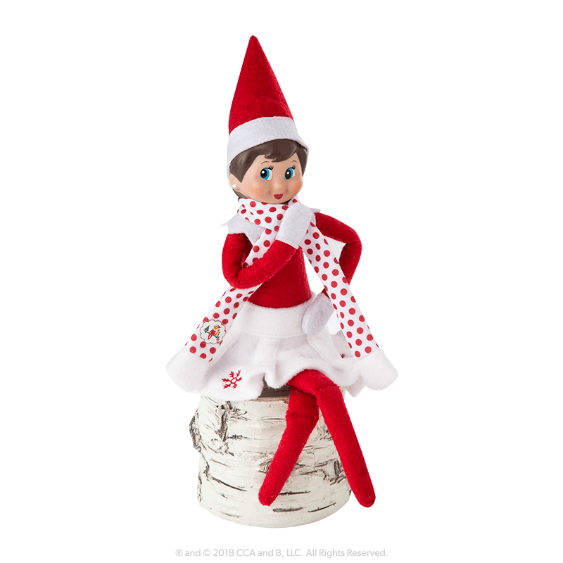 An elf shows off her outfit.