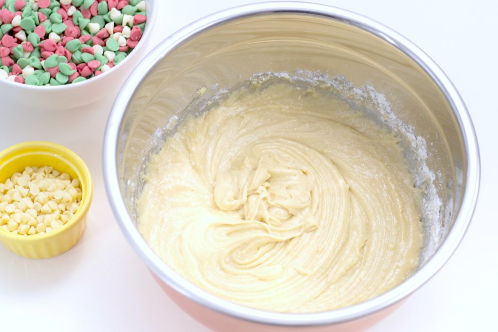 Cake batter with red, green, and white chocolate chips. 
