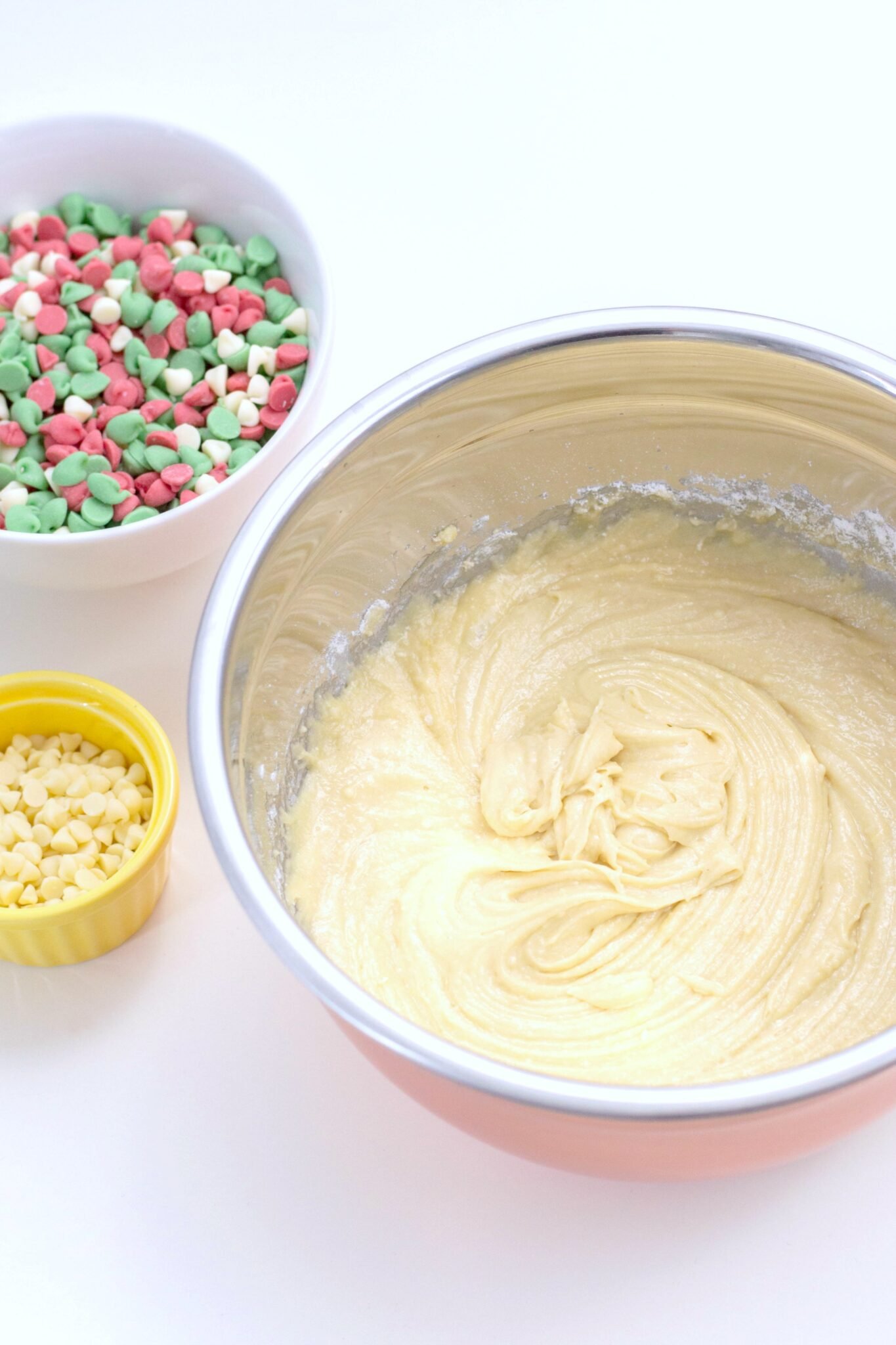 The holidays abound in desserts. In fact, it's one of my favourite parts about Christmas. Try making these. They are the Best Christmas Blondies recipe! #christmasdesserts #christmasblondies #blondies Christmas Blondies batter with chips.