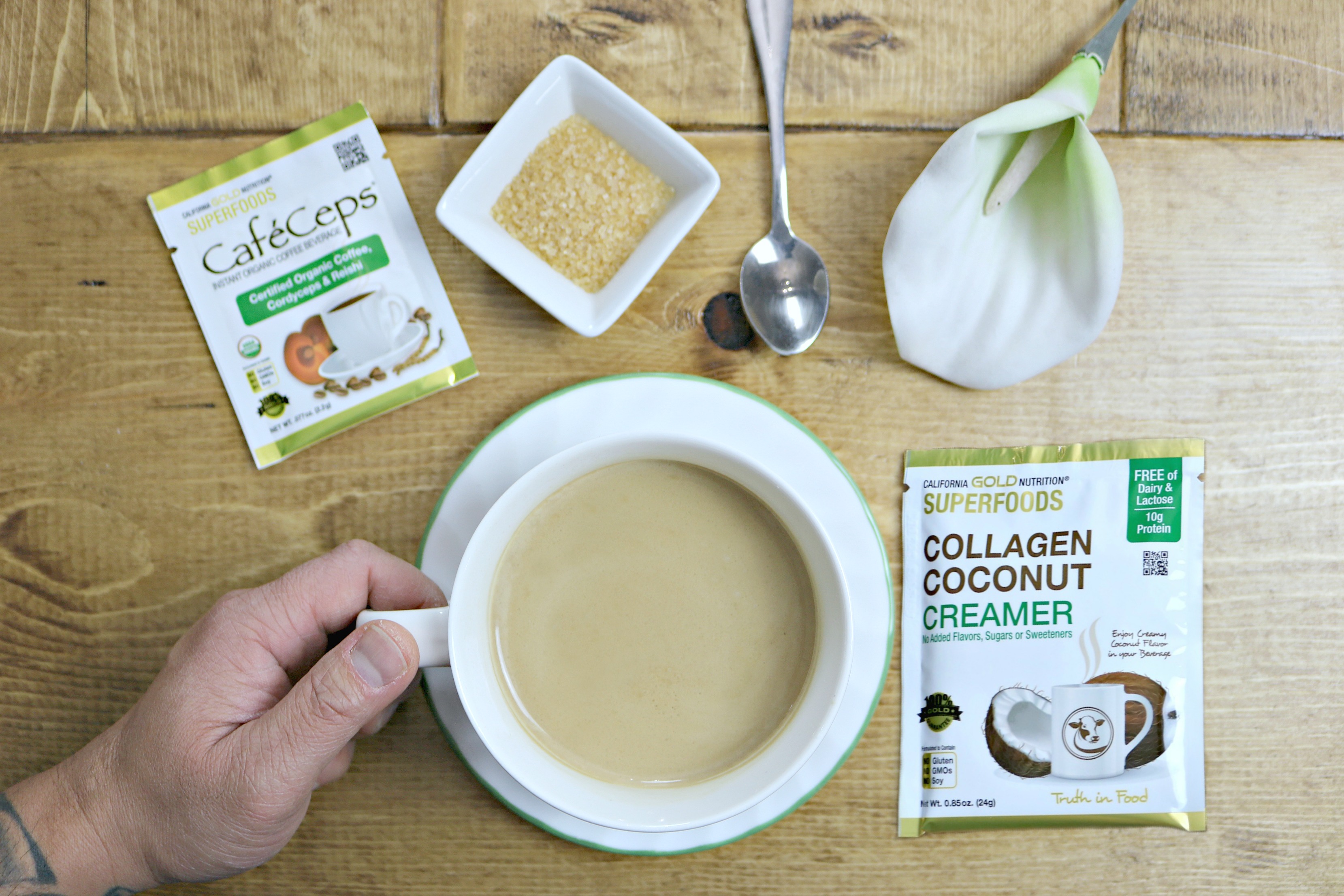 Cup of coffee with collagen coconut creamer and collagen and reishi. 