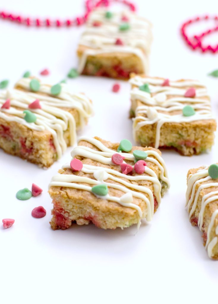 Finished Christmas Blondies on a white surface with red bead garland. 