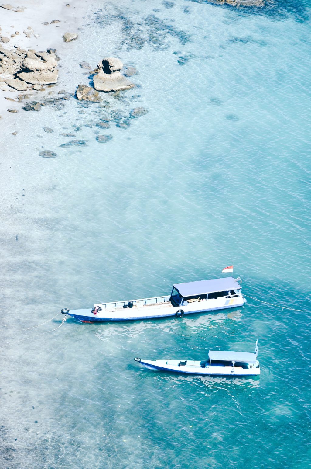 Boats pulled up to the Komodo island in Indonesia. 