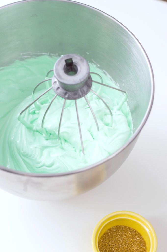 Mixing bowl with food colouring added to egg and sugar meringue mixture.