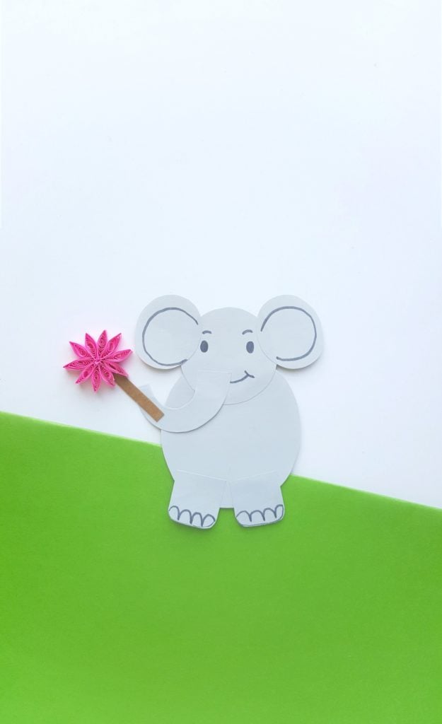 Horton from Horton Hears a Who is on a green and white backround holding a clover.