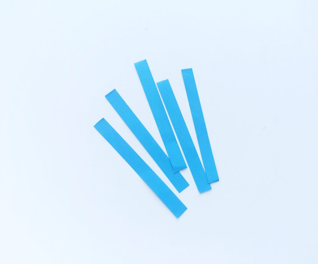 5 strips of blue paper against a white background.