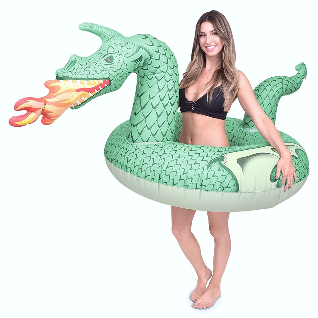 Woman inside hole of fire breathing dragon pool float.