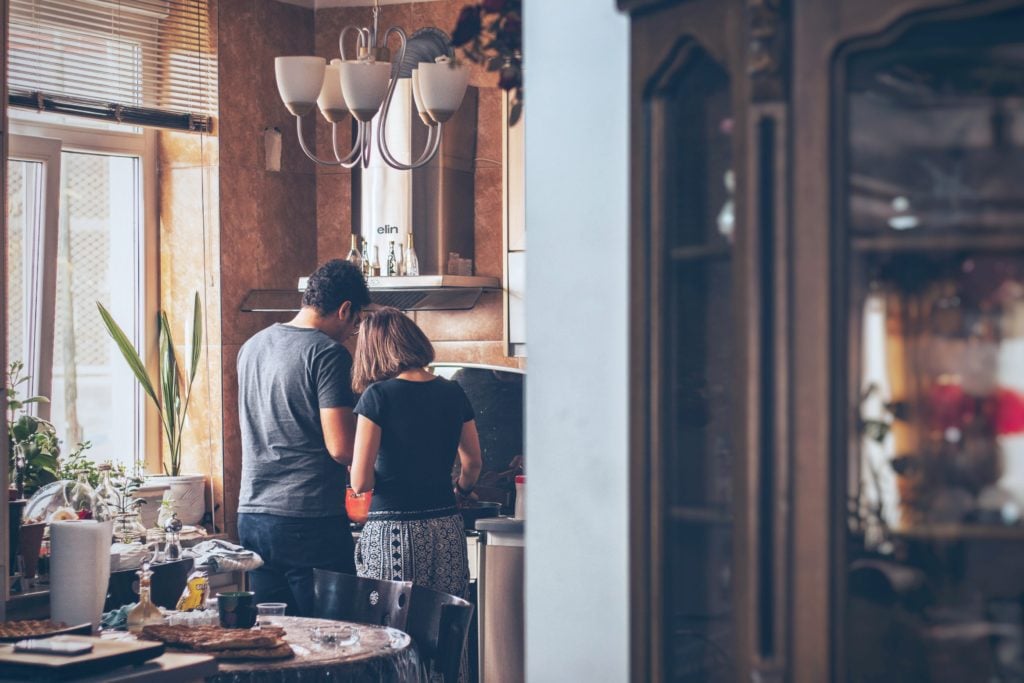 Couple cooking over stove top in a nice and cozy kitchen. Chances are that at least once in your life you’ll suffer some degree of a burn. Here is what to do when you burn yourself. #tips