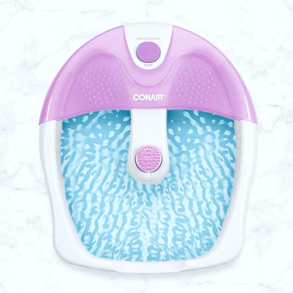 A marble floor holds a Conair Foot Masssager. It is purple and white. 
