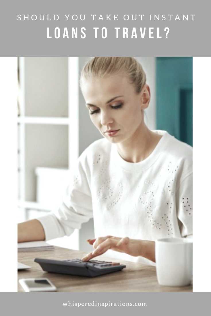 Banner that reads, "Should You Take Out Instant Loans to Travel?" and a woman is pictured below using a calculator to budget.