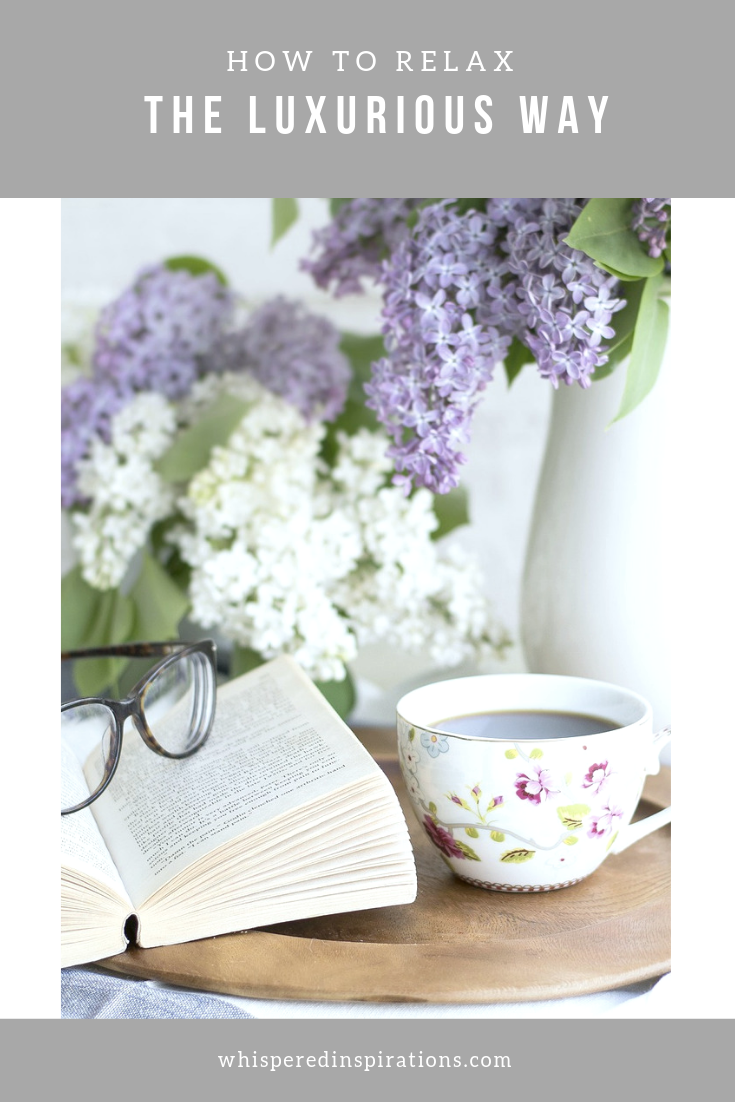 A banner reads, 'How to Relax the Luxurious Way" and has a picture of a calm and serene image of a book, glasses, a cup of tea, and fresh flowers. 