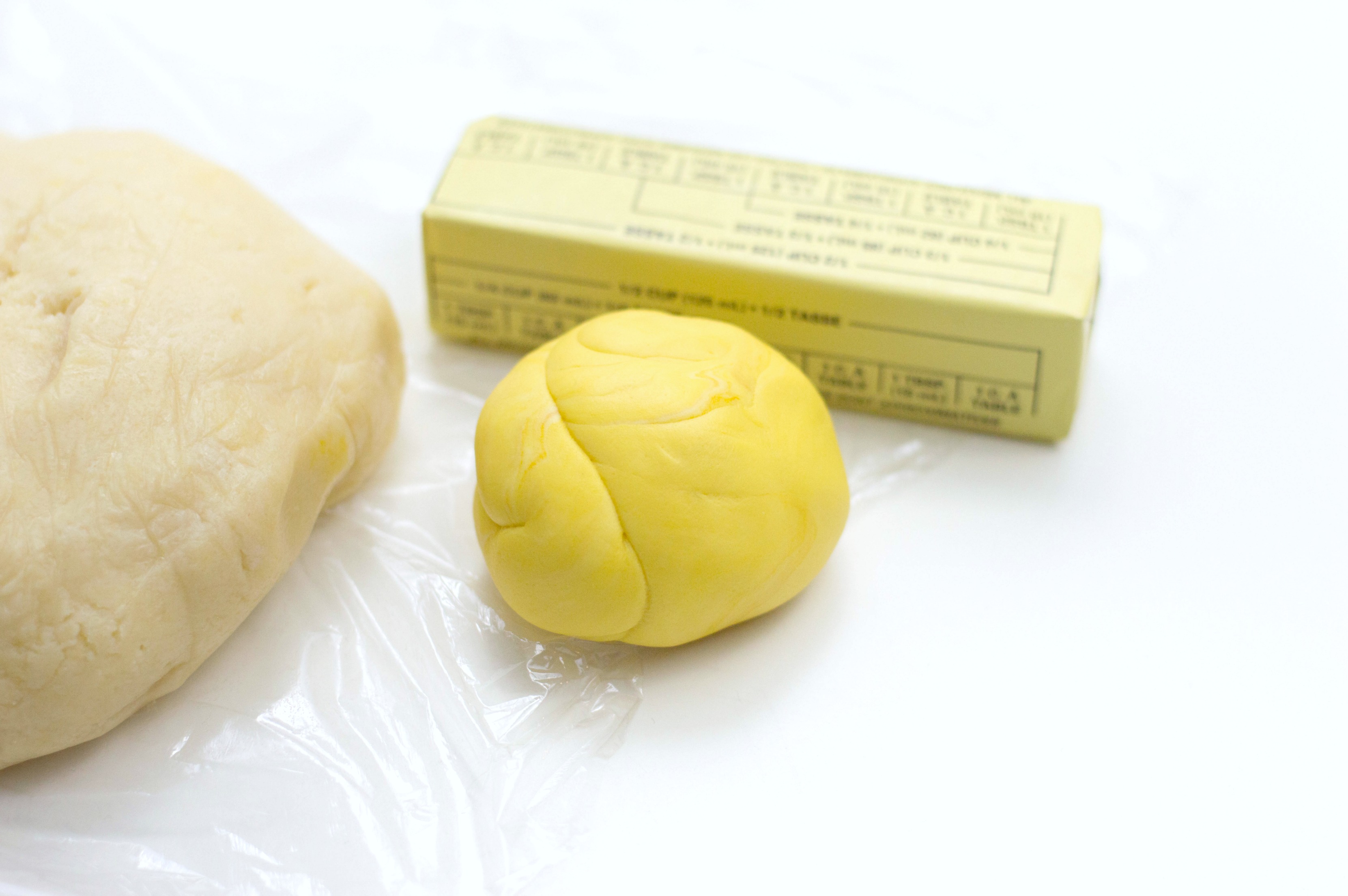 Ingredients needed to make lemon-shaped sugar cookies: sugar cookie recipe, sugar, milk, butter and more, fondant.