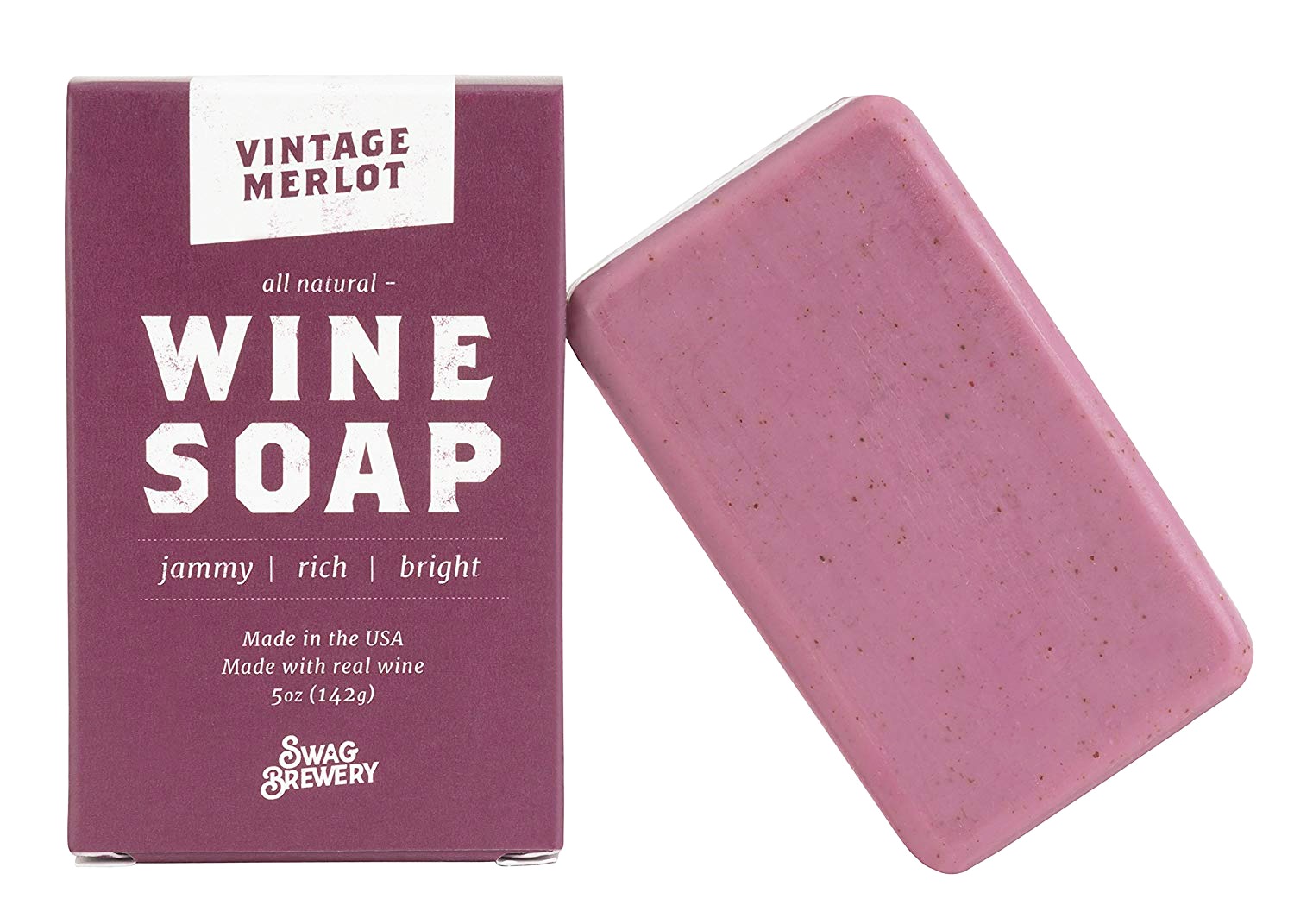 Vintage Merlot, an all natural wine soap is shown leaning on its box that is branded, it's a deep rich, wine coloured soap.