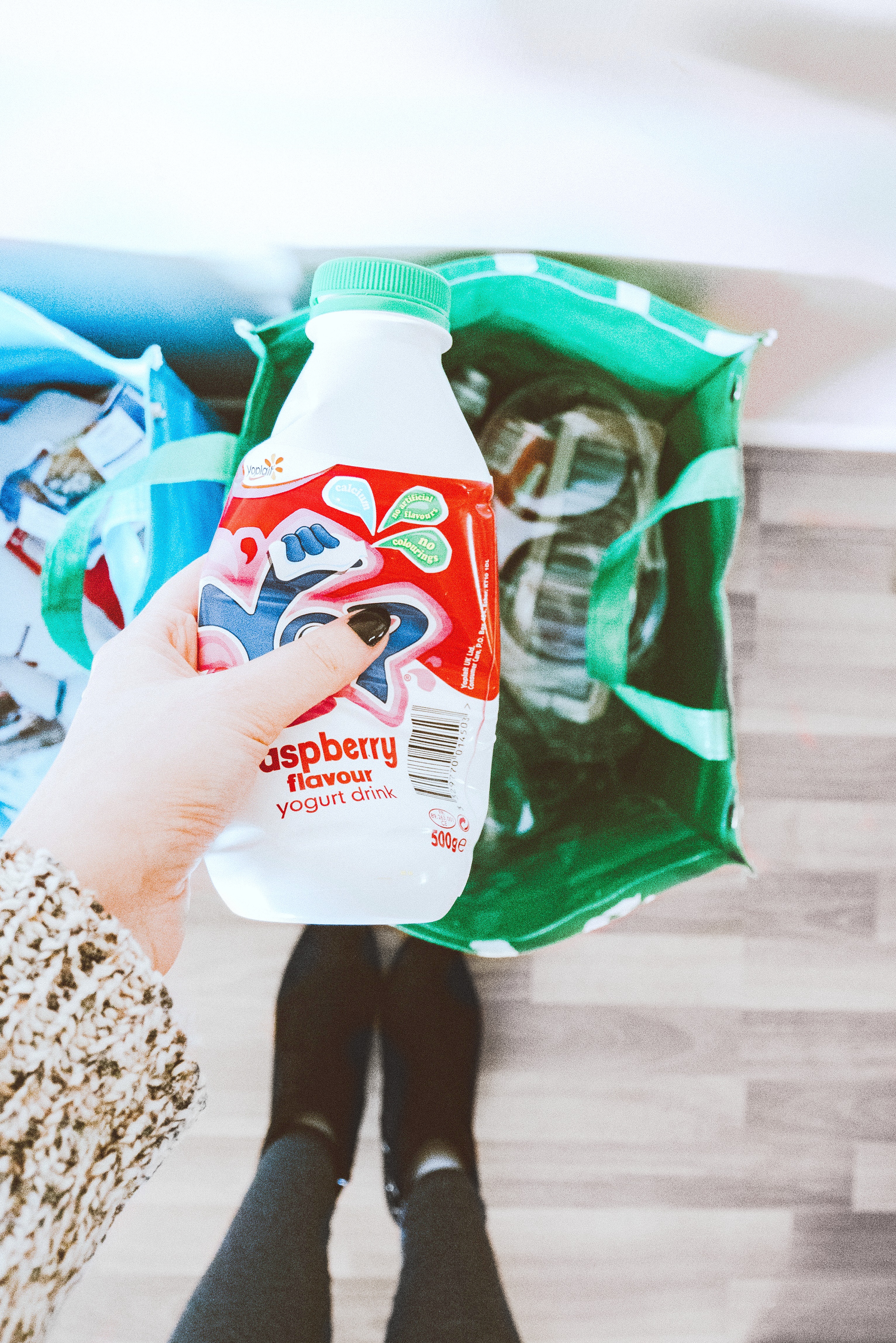 Woman sorting plastic bottles to be recycled. 