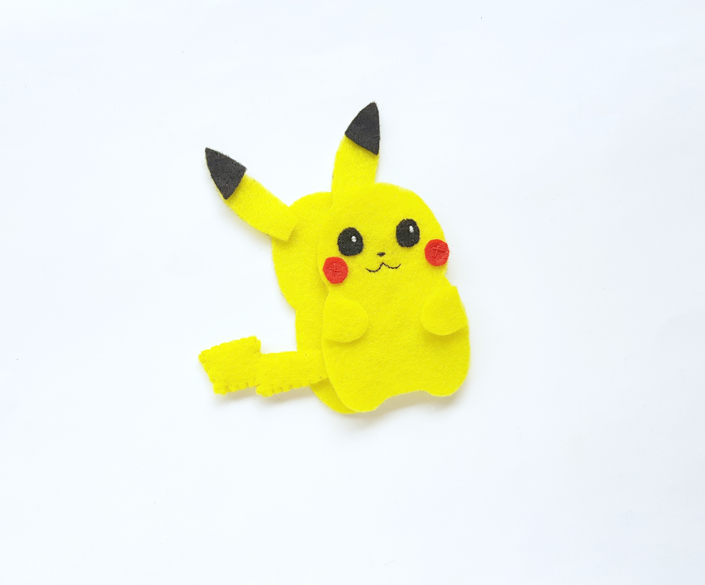 Top half of Pikachu is about to be sewn onto the back half before being stuffed. 