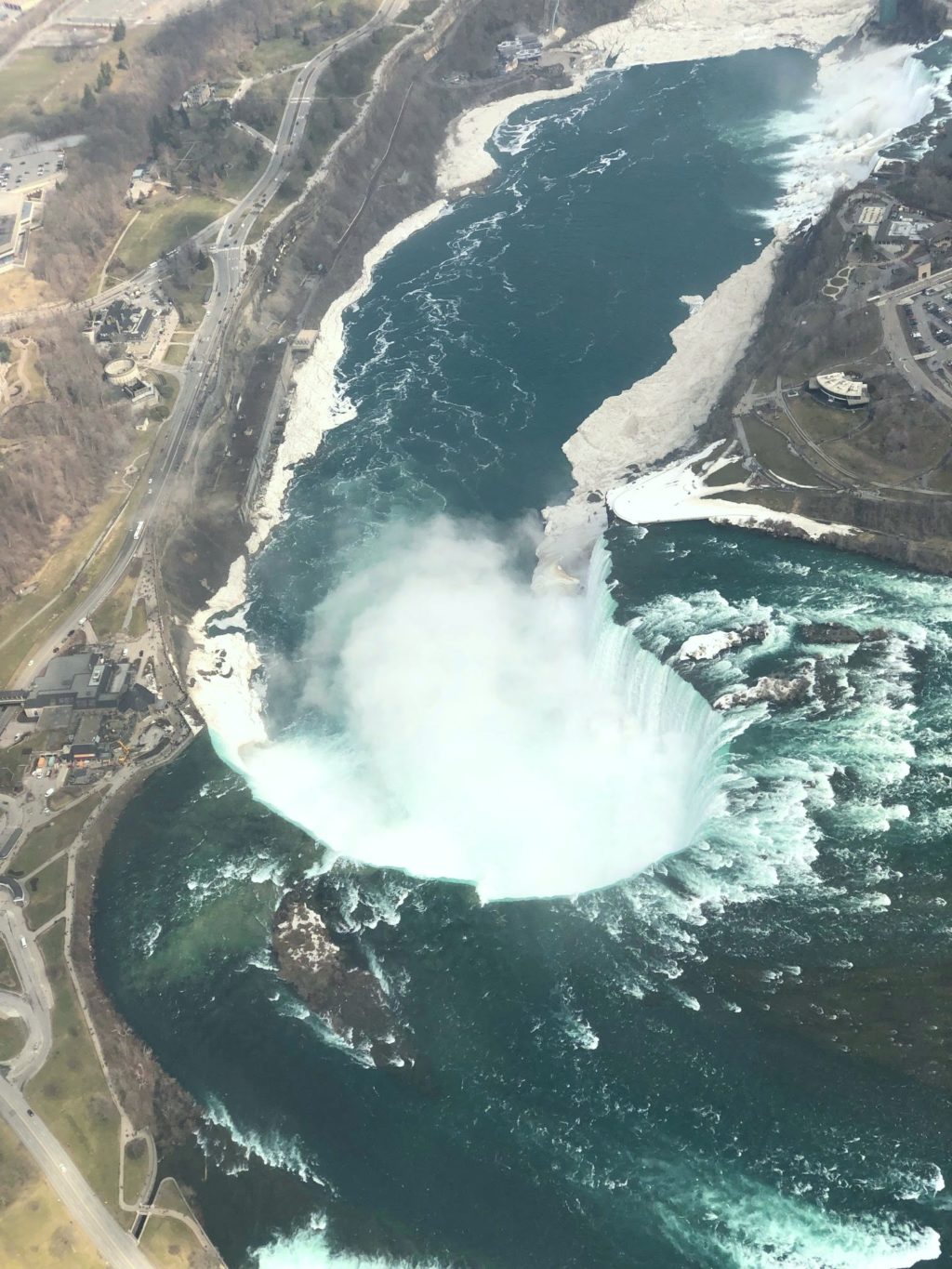 Horse Shoe falls in Niagara Falls, ON via helicopter.
